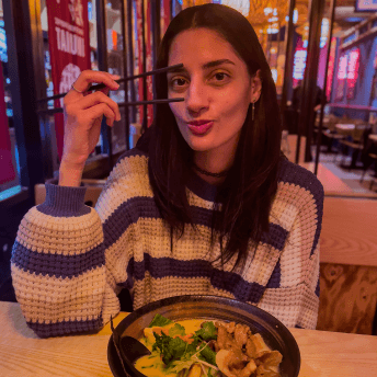 Noemi eating ramen